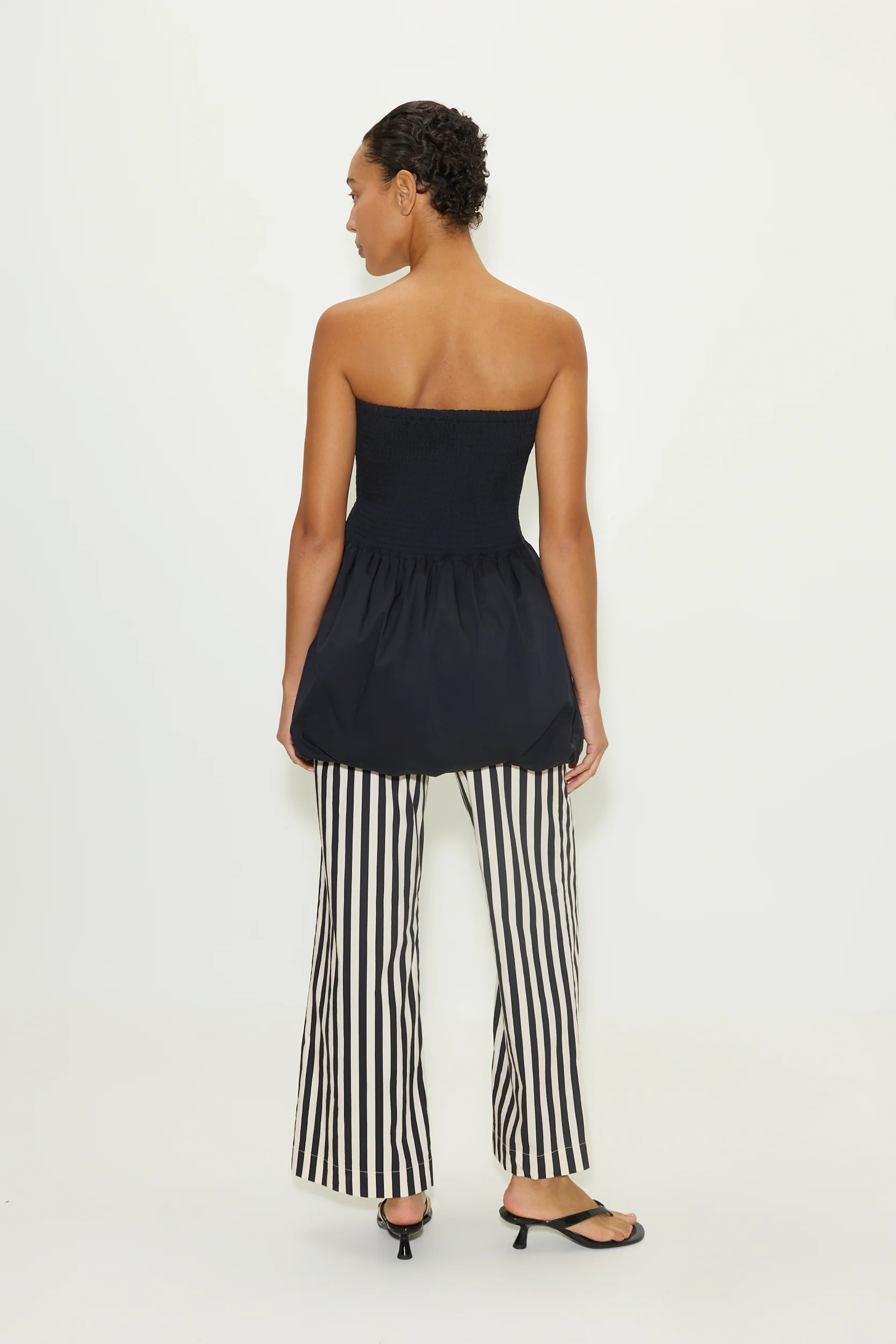 Via Smocked Mini Dress in Black - Image 4